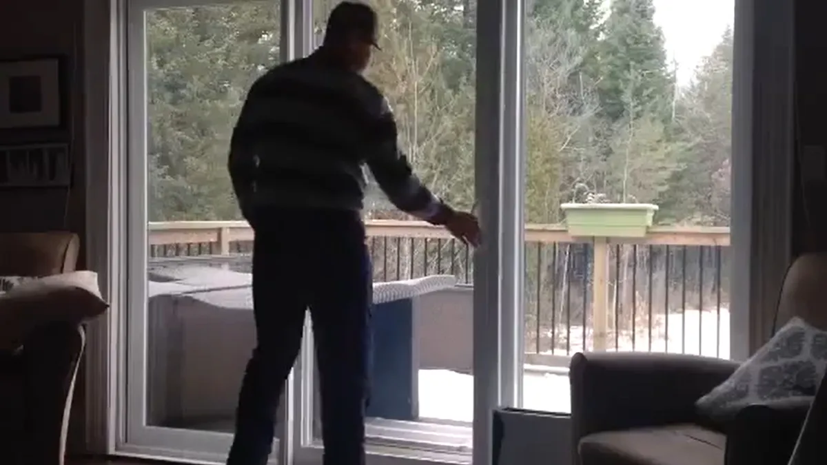 Man opening sliding door