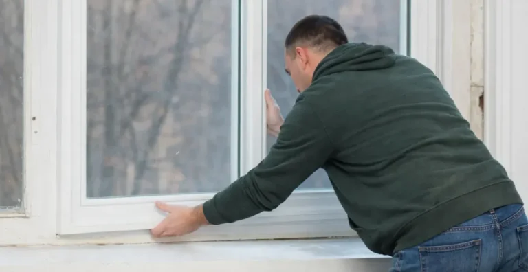 Technician installing a custom window insert